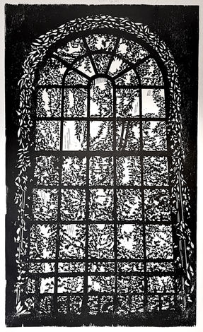 Symmetrical arched window with wild Ivy masking the light from within.