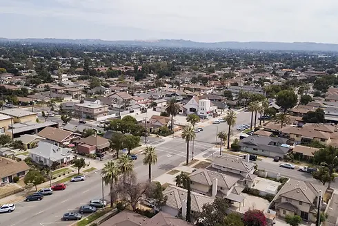 Aerial view of the City of Azusa. Many homes are in view.