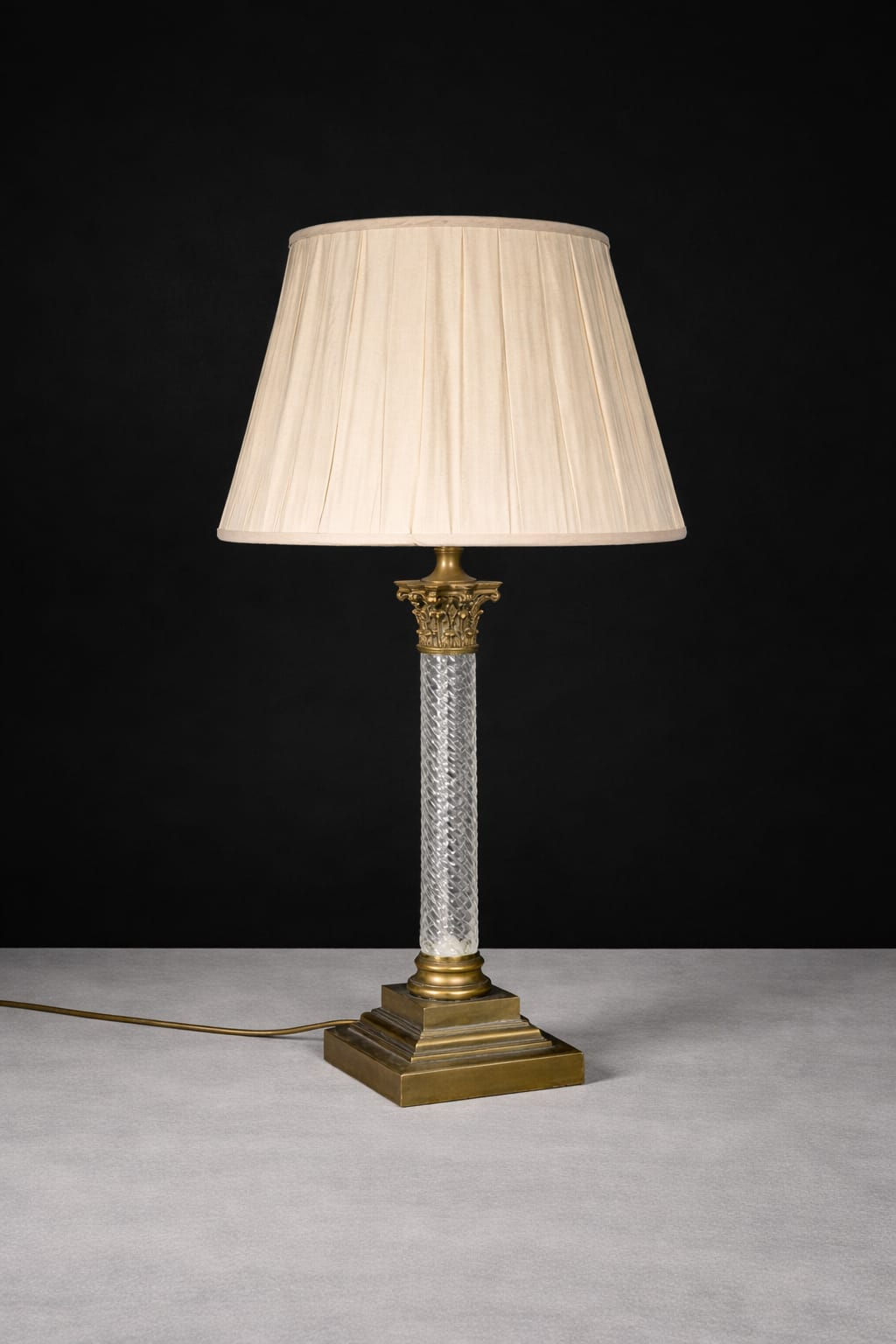 Single brass and spiral glass column table lamp with stepped square base