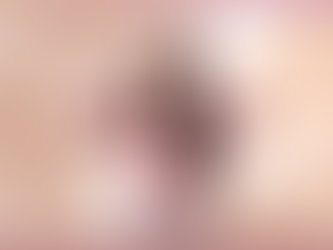 Lady with long brown hair wearing glasses and a pink top holds her head in her hands to show she's forgotten something