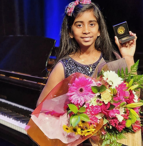 Student receiving RCM Celebration of Excellence Gold Medal award