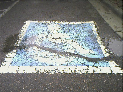 Pavement Defect on ADA Signage