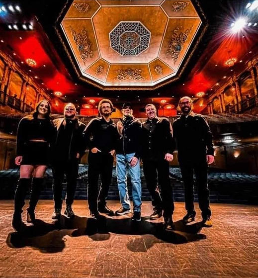 Photo of Rock Anello, of Wild Honey, at a theater for a performance