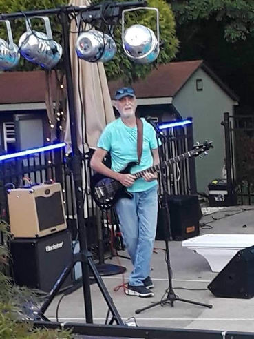 Rock Anello, of Wild Honey, playing the guitar