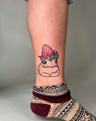Strawberry frog tattoo on leg by Kaia