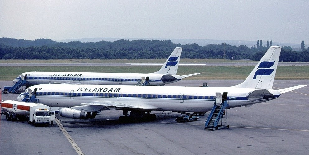 A pair of Douglas DC-8's (early 80's) probably same plane flown by Al Oerter & Company
