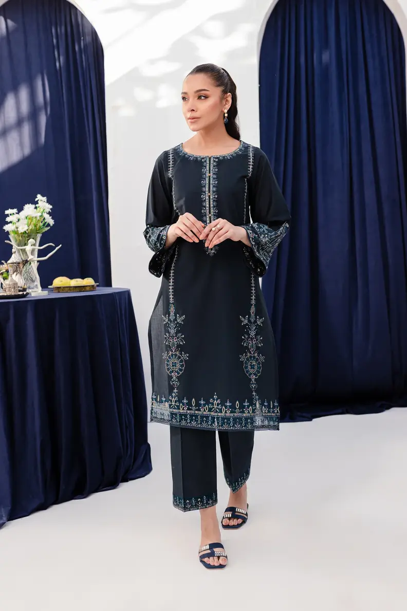 Model is wearing Pakistani brand Batik's Timber Blue Color Cotton Embroidered Co-Ord Set with a shirt & trouser
