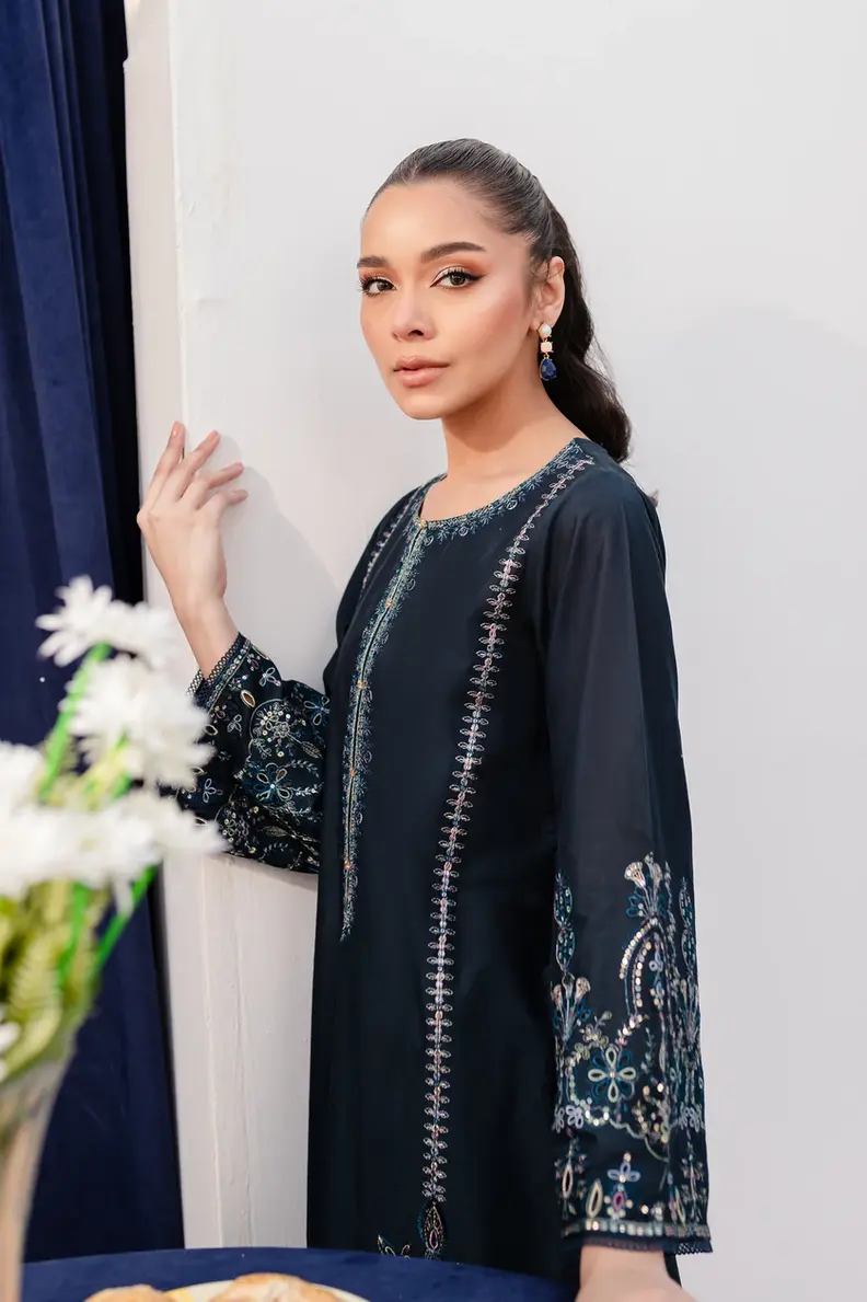 Model is wearing Pakistani brand Batik's Timber Blue Color Cotton Embroidered Co-Ord Set with a shirt & trouser