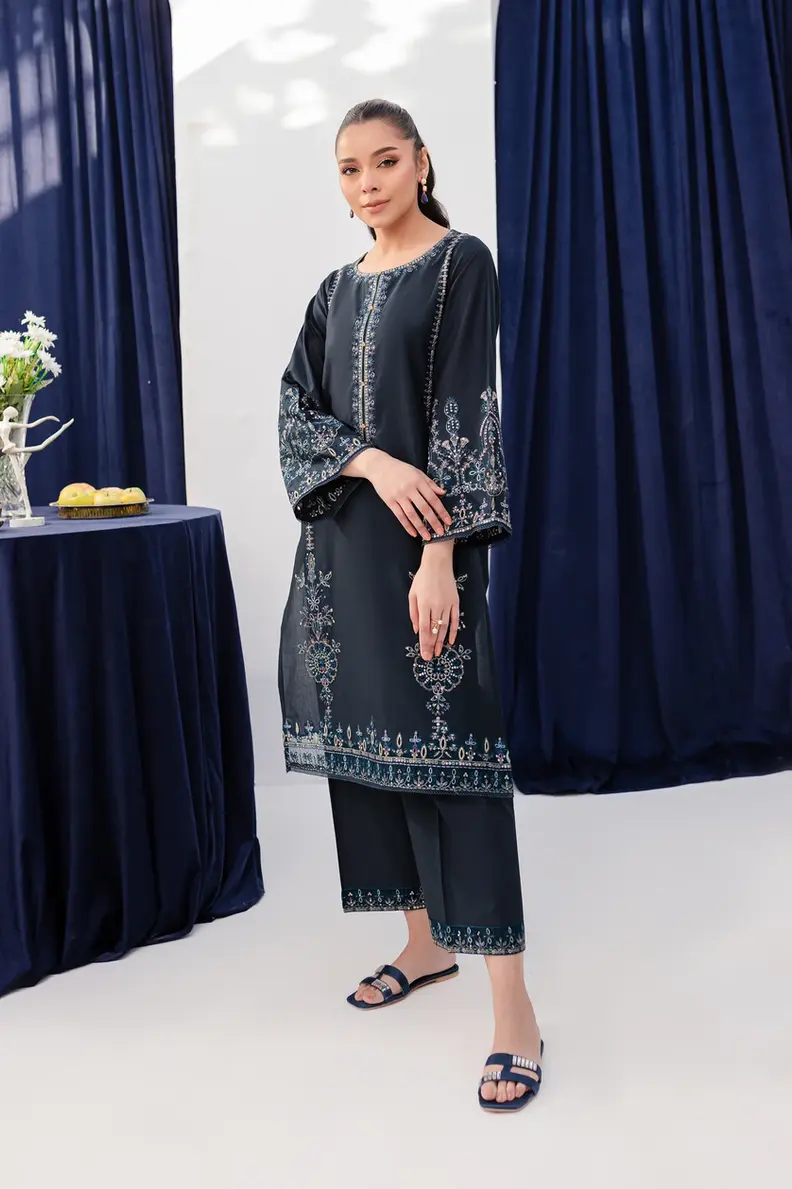 Model is wearing Pakistani brand Batik's Timber Blue Color Cotton Embroidered Co-Ord Set with a shirt & trouser
