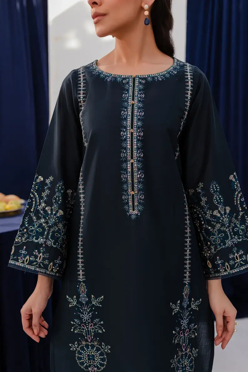 Model is wearing Pakistani brand Batik's Timber Blue Color Cotton Embroidered Co-Ord Set with a shirt & trouser