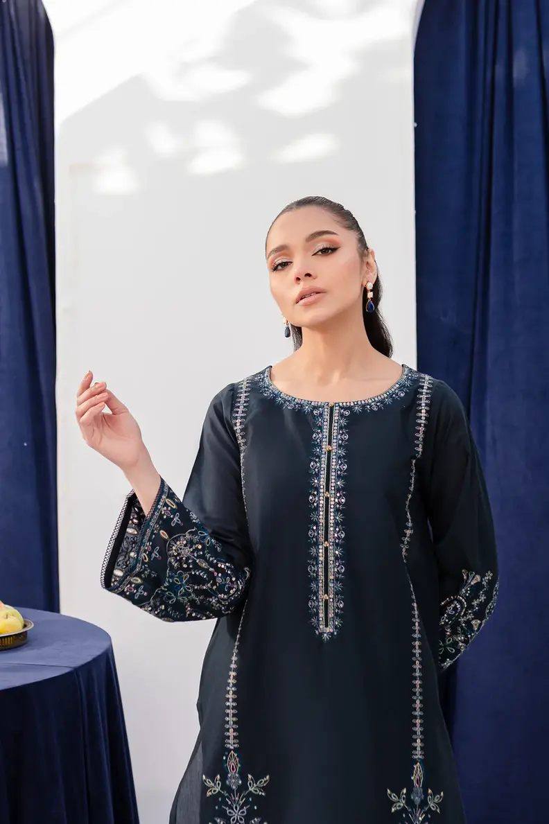 Model is wearing Pakistani brand Batik's Timber Blue Color Cotton Embroidered Co-Ord Set with a shirt & trouser