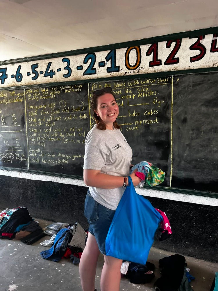 Martha helping to organise donated clothing and resources for pupils at Jubilee School.