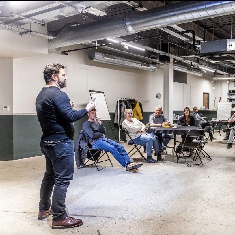 Speaking to a room of professionals at a workshop