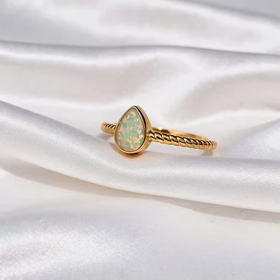 Solitaire pear shape ring with a stylish braided shank.