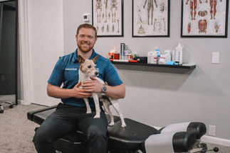 Dr. Henson and His Dog in The Domino Chiropractic Office 