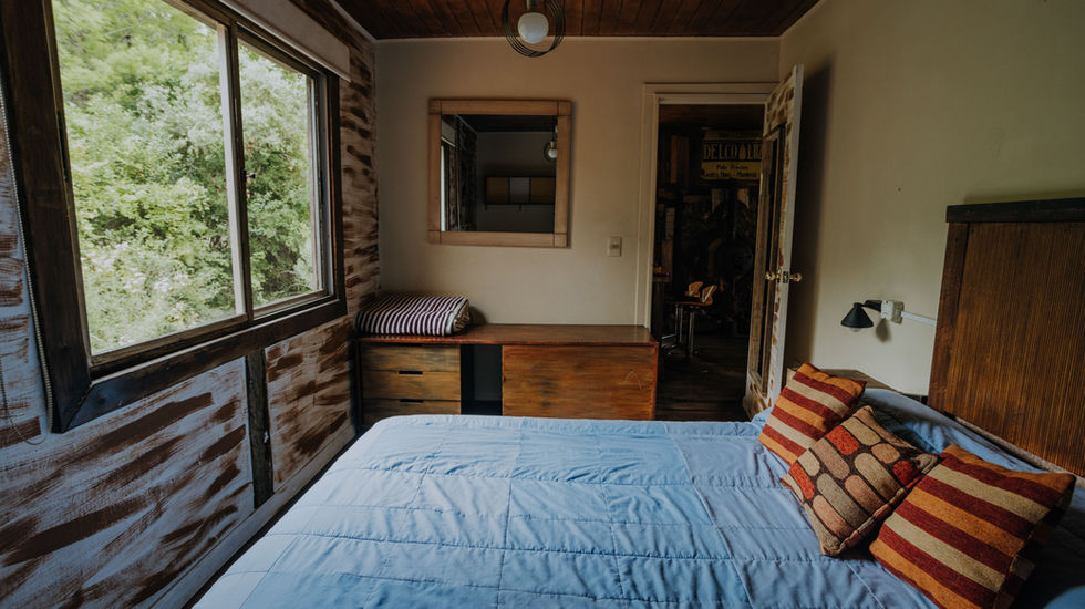habitación matrimonail con vista al bosque