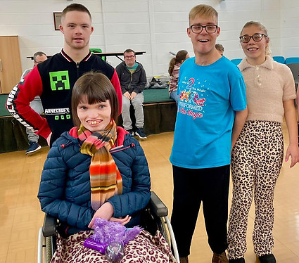 A group of friends from Lotus Enrichment Centre Swadlincote, smiling together for a photo_