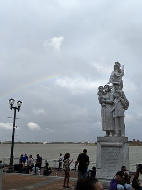 mississippi river harbor port with rainbow and statue supporting our immigrants