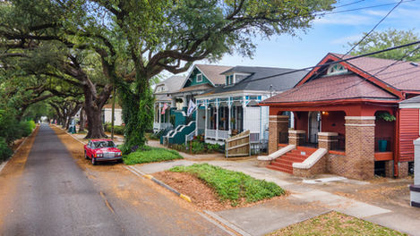 historic new orleans double shotgun near jazz fest with porch and brick