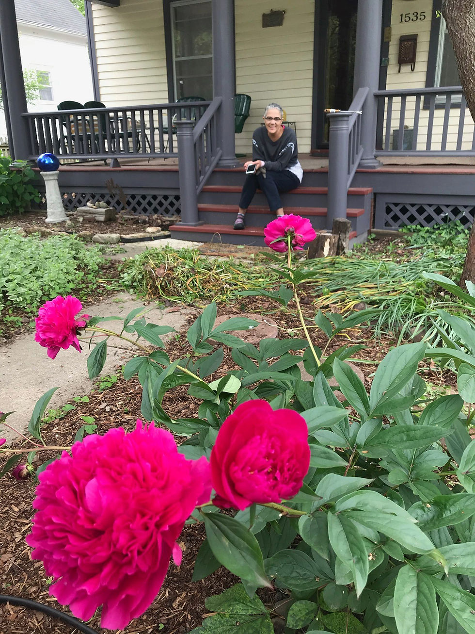 Mary in front of her home, photobombing the peonies one spring day in the pandemic