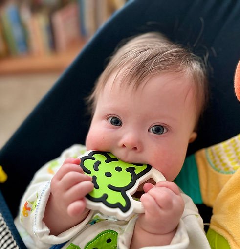 infant with brain toy