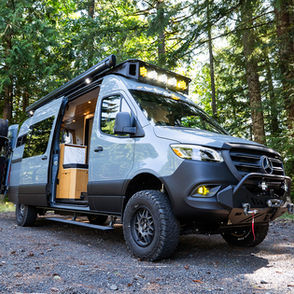 Exterior of a Sprinter 170 adventure van conversion with Limitless Van safari rack and CAtuned Off-Road Front bumper.