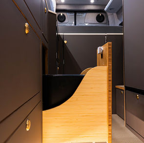 Pull-out trash can for van conversion.