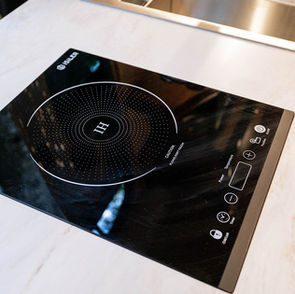 Single induction cook top in Sprinter van conversion