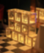 Hayley Stoner's She who fell book launch and live music experience event for the release of her debut memoir she who fell. She who fell light boxes made from balloon boxes and the letters for she who fell on each box. The boxes contact LED lighting.