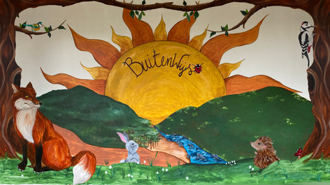 Muurschildering speelplaats BuitenWijs school Neigem Ninove