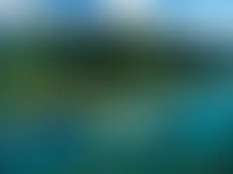 Vue aérienne du lagon turquoise de Bora Bora, symbole d'un voyage sur mesure en Polynésie