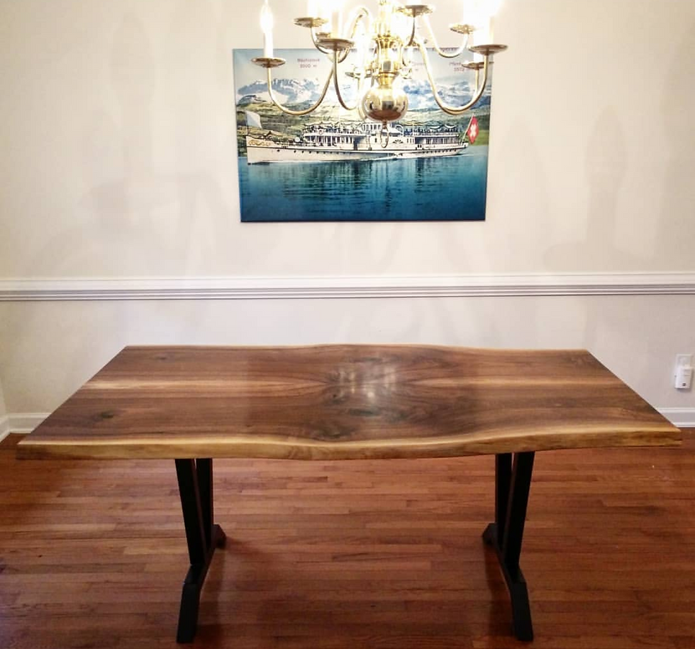 walnut table made from two book-matched with a black steel base