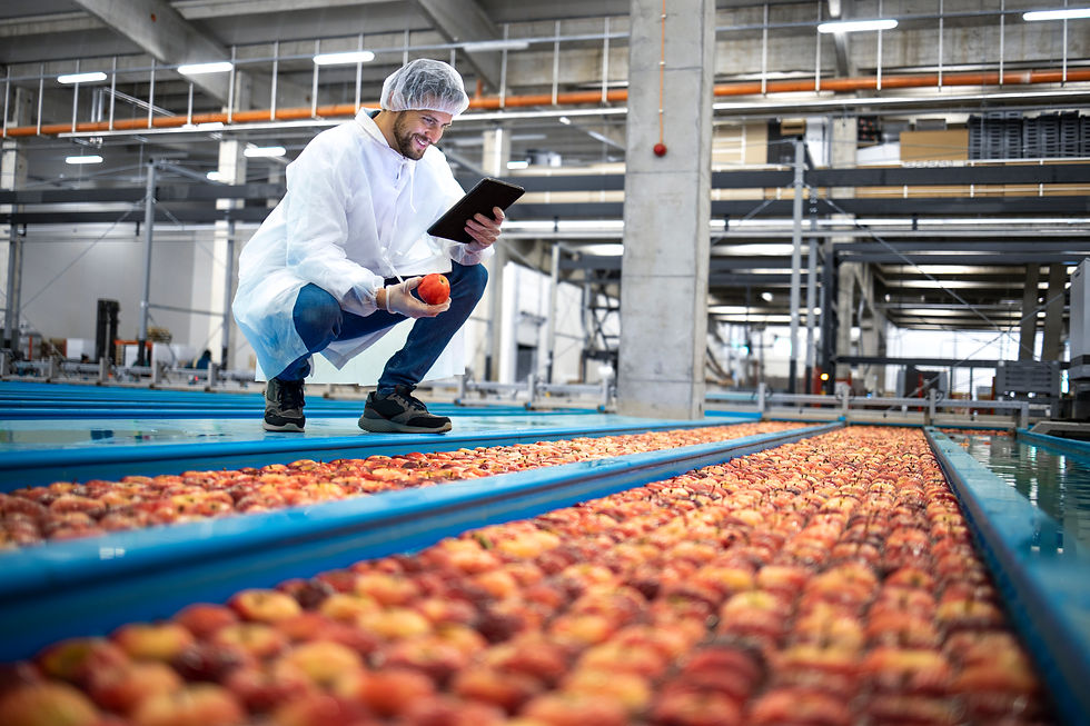 technologist-with-tablet-computer-standing-by-water-tank-conveyers-doing-quality-control-a