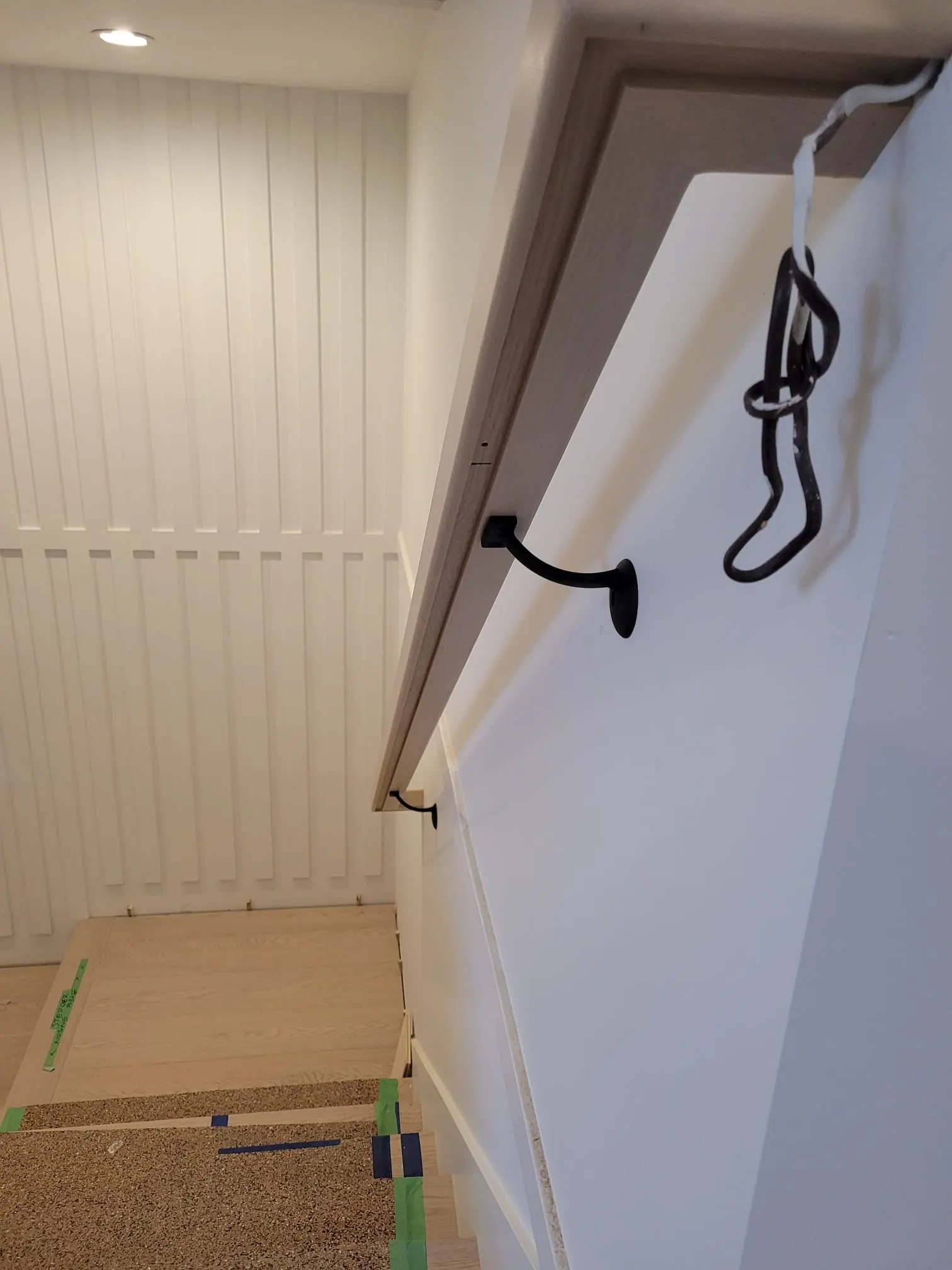 Recessed LED lighting under interior stair handrail for a clean, modern stair design