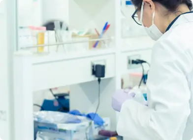 Four expert dermatologists from KINS Clinic in Singapore, specializing in advanced acne treatments, standing together in a professional setting.