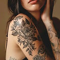 Photo of a large tattoo on a woman's shoulder, covering a wide area. Comprehensive tattoo removal treatment options are available in Singapore for large tattoos.