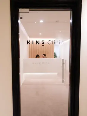 The entrance of KINS Clinic in Singapore, showcasing a modern and welcoming design for acne treatment patients.
