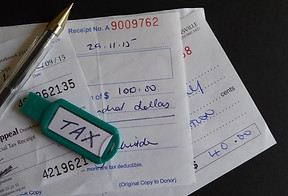 writing-receipt-giving-charity-label-bra
