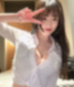 하리미 Halimi takes a sensual selfie alone in her Tokyo hotel room at night, showcasing her radiant beauty and alluring curves under soft lighting.