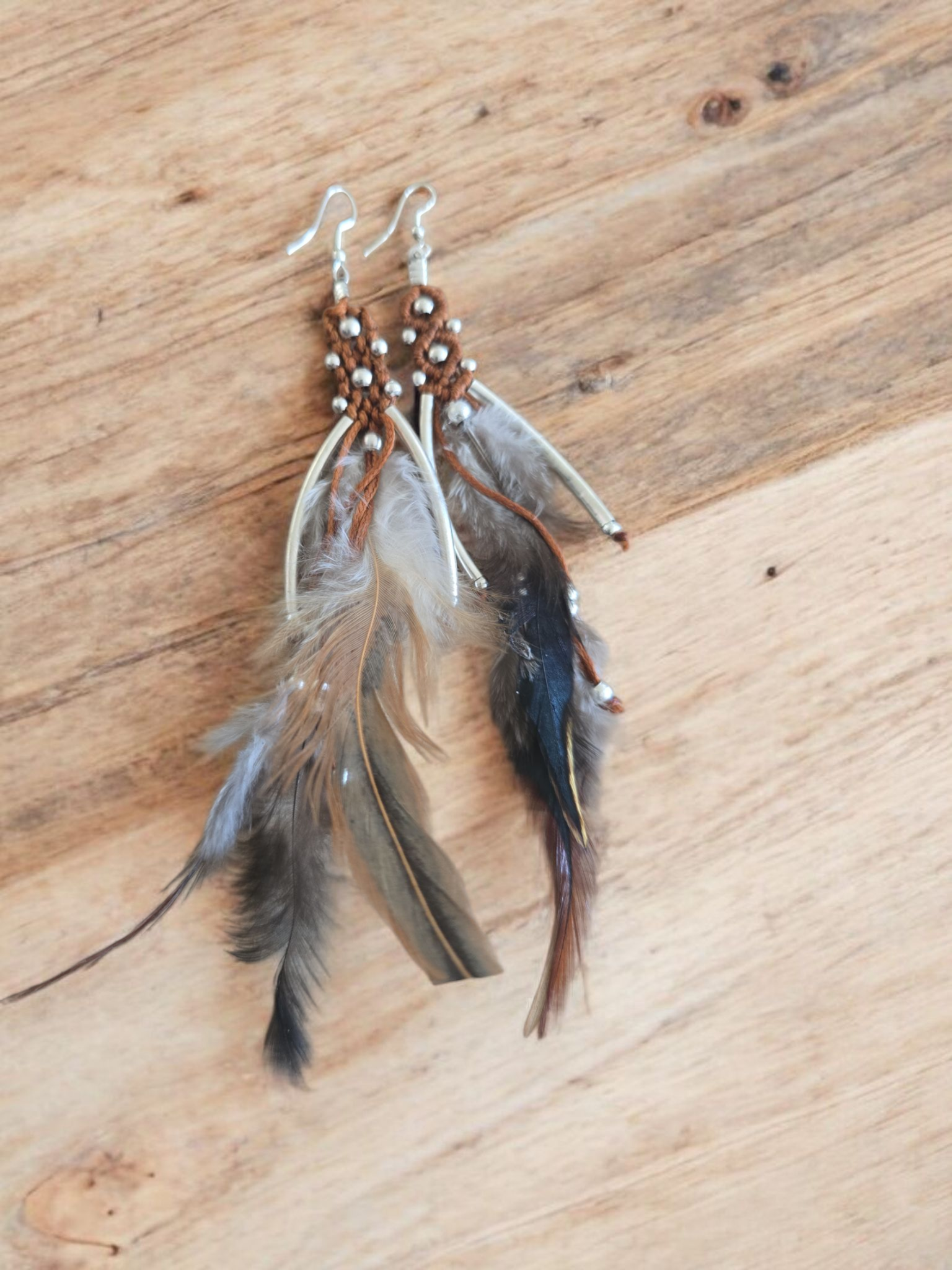Brown and silver embroidery and feather earrings