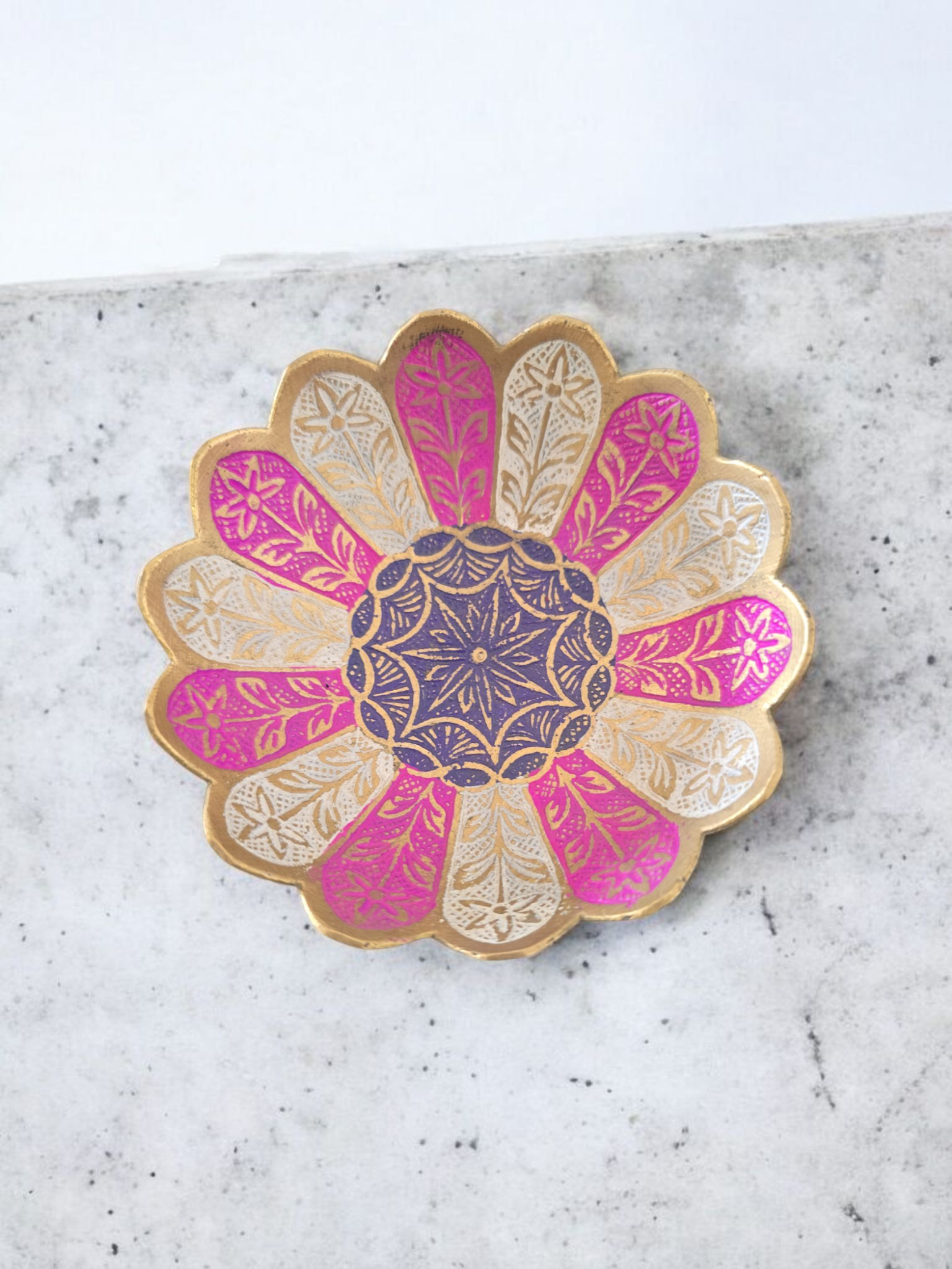 A cassock decorated with a colorful pink and white flower