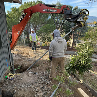 Foundation Repair with helical pier installation.