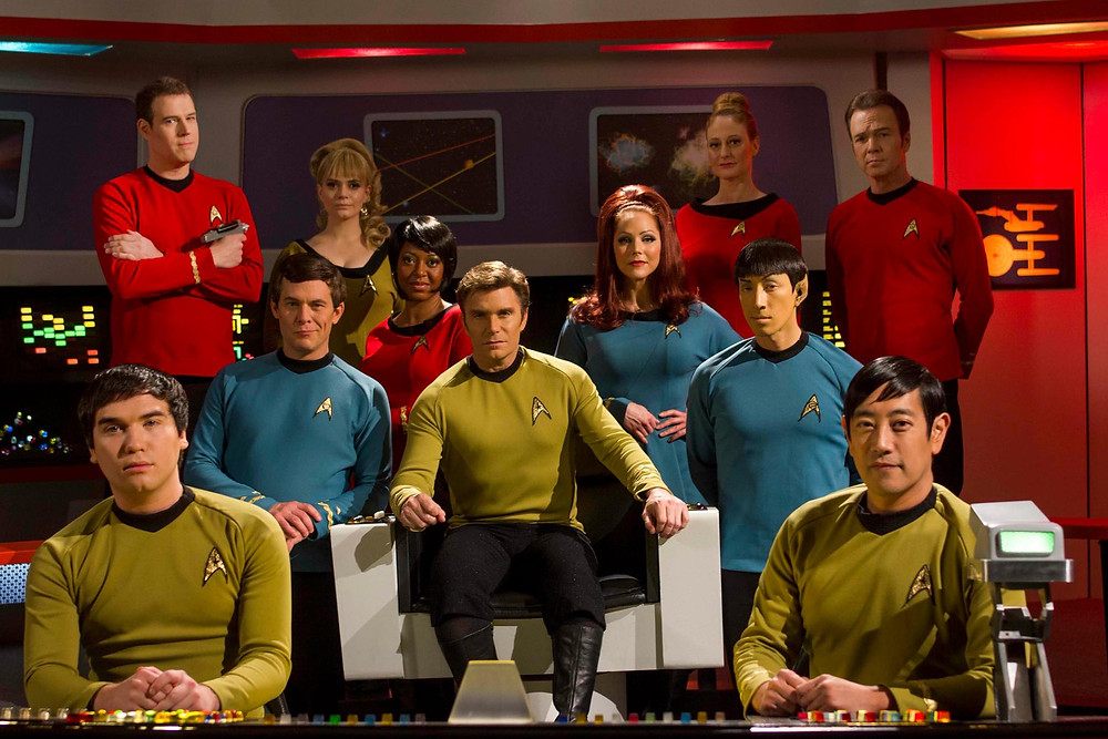 On the set of the multi-award-winning web series "Star Trek Continues" (from left) Wyatt Lenhart as Pavel Chekov; Steven Dengler as Lt. William Drake; Chuck Huber as Doctor Leonard H. McCoy; Kipleigh Brown as Lt. j.g. Bargara Smith; Kim Stinger as Lt. Uhura; Vic Mignogna as Captain James T. Kirk; Michele Specht as Lt. Elise McKennah, PhD; Cat Roberts as Lt. Elizabeth Palmer; Todd Haberkorn as Commander Spock; Grant Imahara as Lt. Hikaru Sulu; Chris Doohan as Lt. Commander Montgomery Scott (photo © Trek Continues, Inc.)