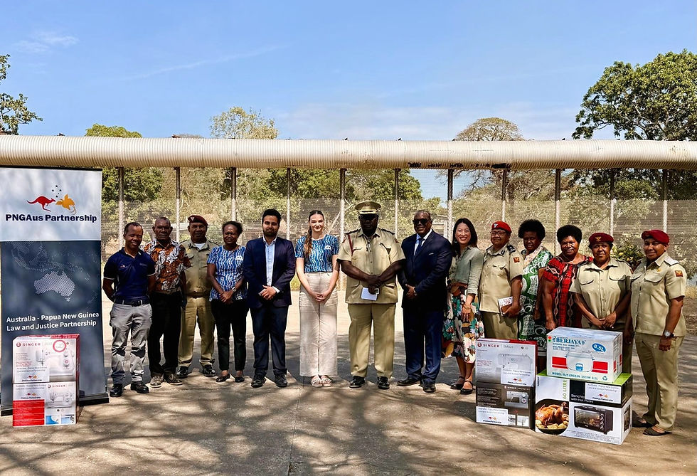 Representatives from the Papua New Guinea Correctional Service (PNGCS), the Australian High Commission, and the Australia–Papua New Guinea Law and Justice Partnership (APLJ) with the sewing and cooking equipment donated.