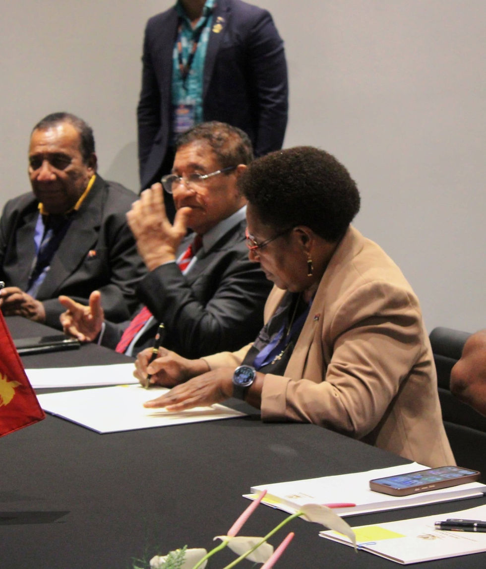 Central Province Madam Governor, Rufina Peter, and member for Rigo District and Minister for Planning Sir Ano Pala together with acting Central Provincial Administrator Mr. Magini Raga signing the agreement.