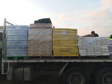 HON. JOHN KAUPA MP DELIVERS FOOD RATIONS TO EVICTED SETTLERS OF PORTION 528, EIGHT MILE