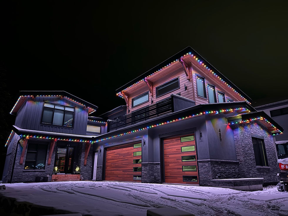 Eye-level view of a gemstone light illuminating a backyard patio at dusk