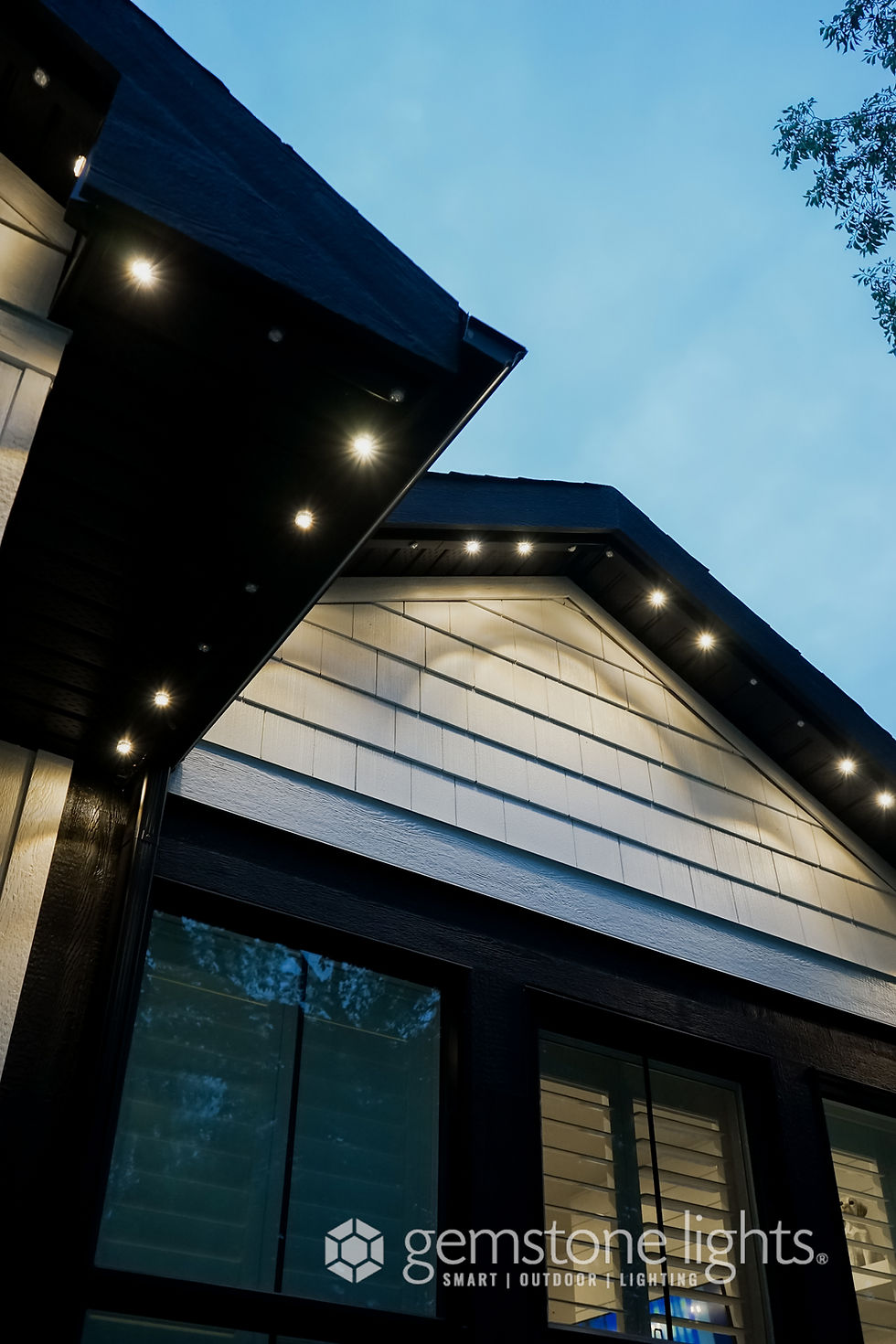 Close-up view of a gemstone light fixture covered in snow