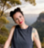 Angela from The Awen Room in Leura standing on a Blue Mountains cliff, reflecting on well-being and earth-based wellness in nature.