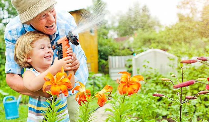 woman gardening in front of her home